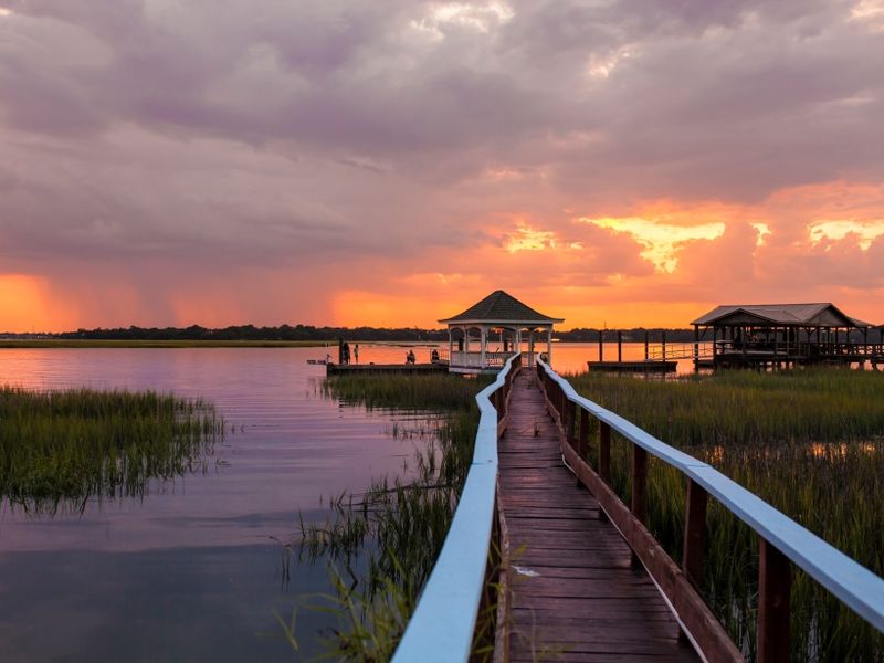 family-on-dock-at-sunset