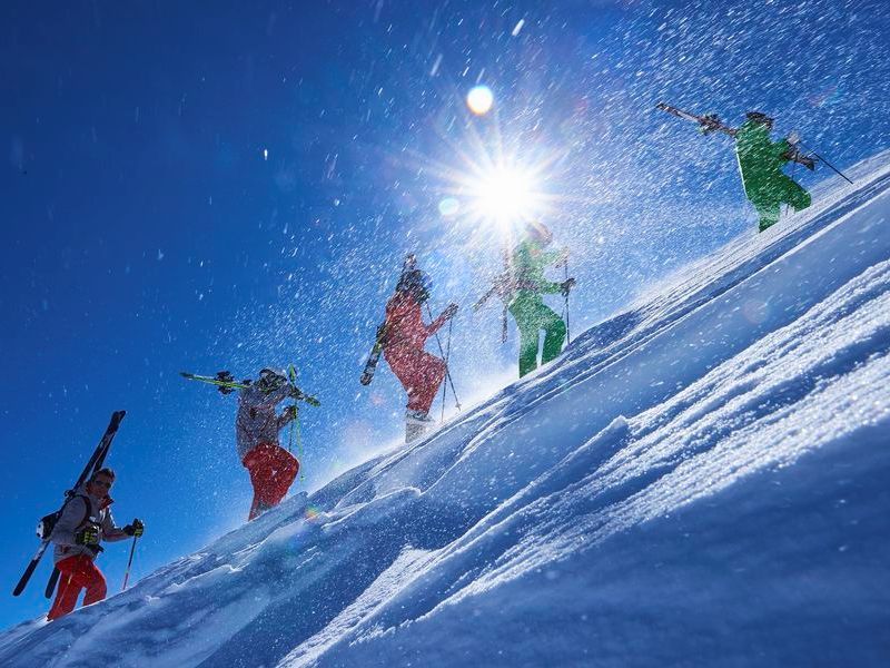 five-male-skiers-trudging-up-steep-sunlit-mountain-2026-01-09-09-38-05-utc