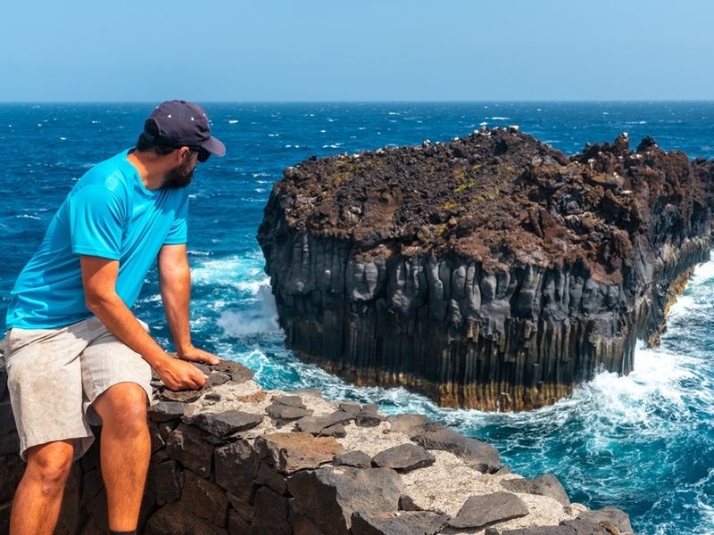 a-young-man-looking-at-the-roque-de-las-gaviotas