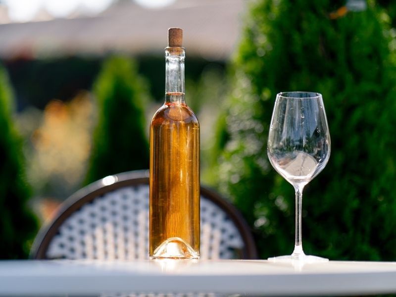 glass-bottle-with-wine-and-a-glass-stand