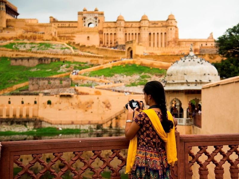 woman-tourist-taking-a-photo-of-the-amer-fort