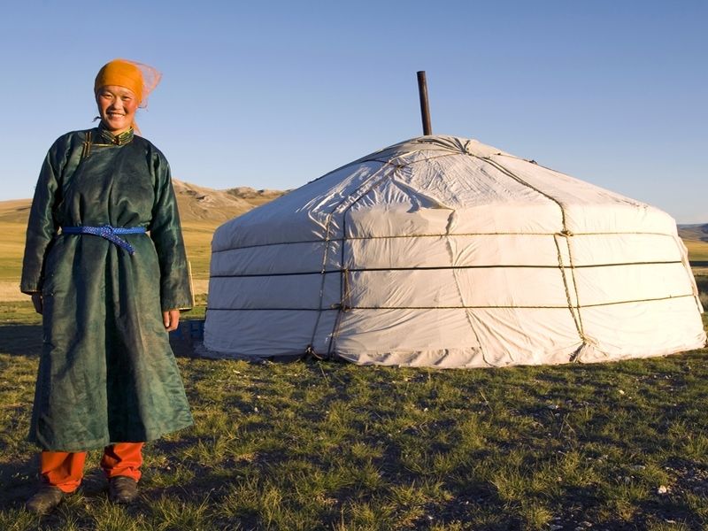 mongolian-woman-standing-in-front-of-the-tent