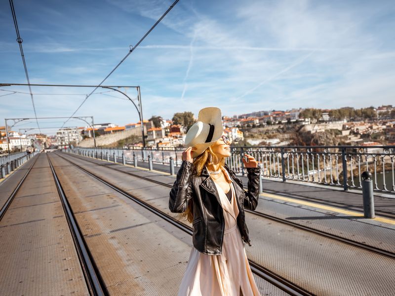 stylish-woman-posing-on-historic-dom-luis-i-bridge-2026-03-24-04-27-36-utc