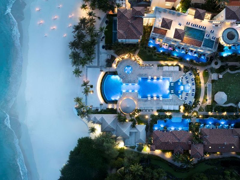 Travel_Advisor_Asset-SBR-Drone-Pool-Beach-Night-Birds-eye